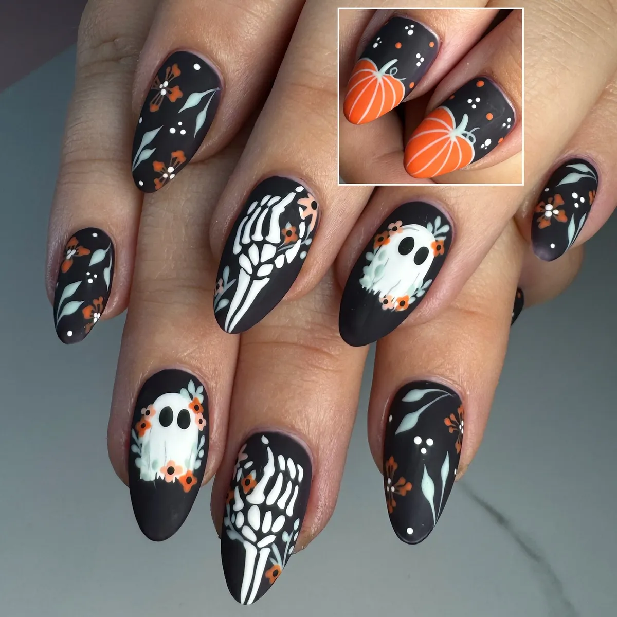 Matte black set with ghosts, skeleton hands, and floral accents