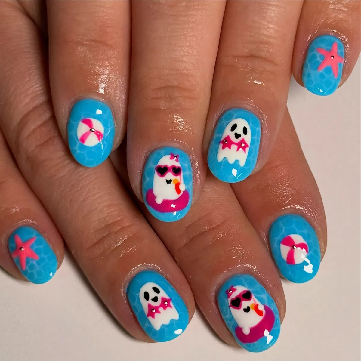 Bright blue ghost nails with pink accent mix