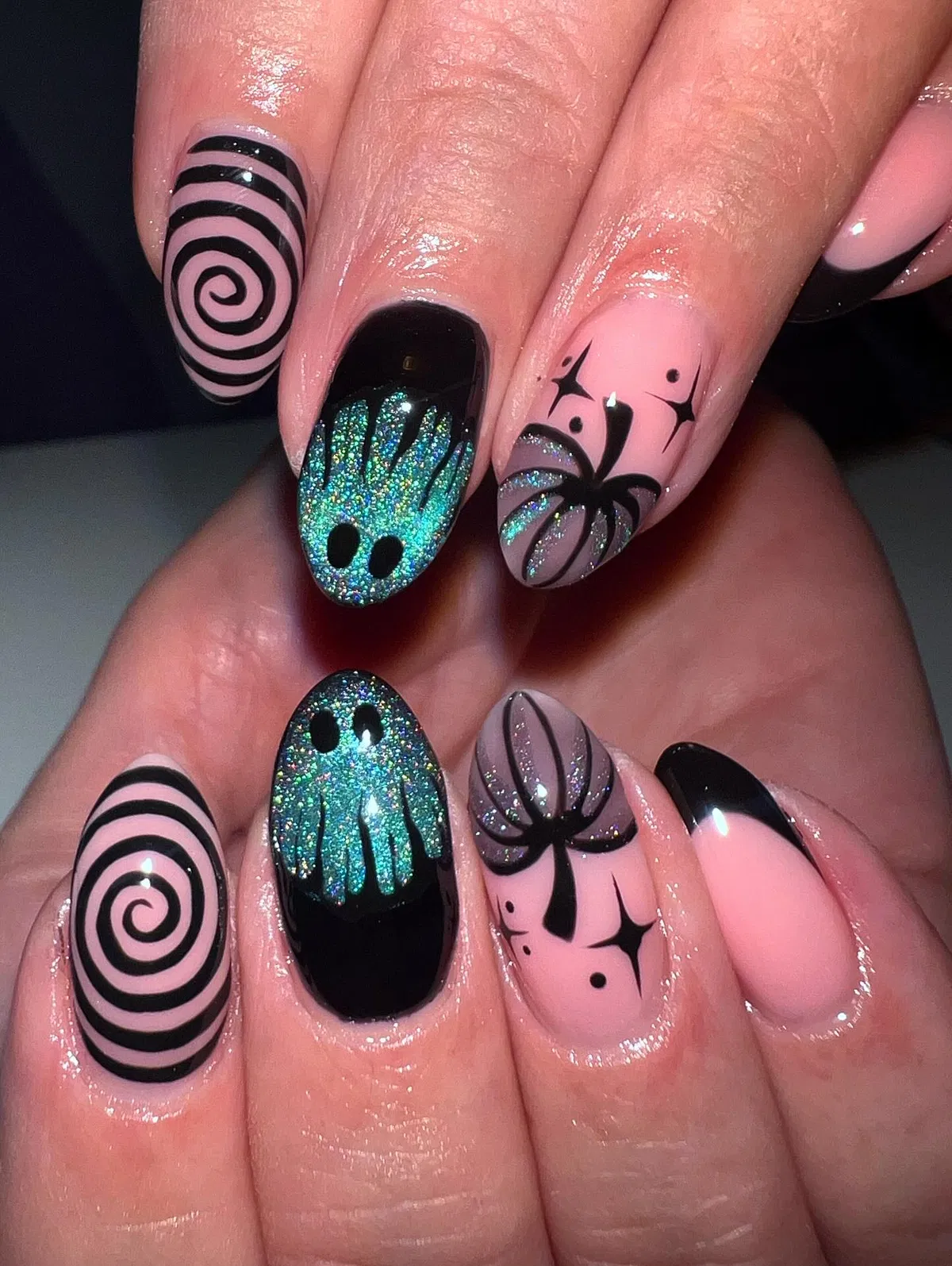 Pink-and-black mix with spiral stripes and glittery ghost silhouettes