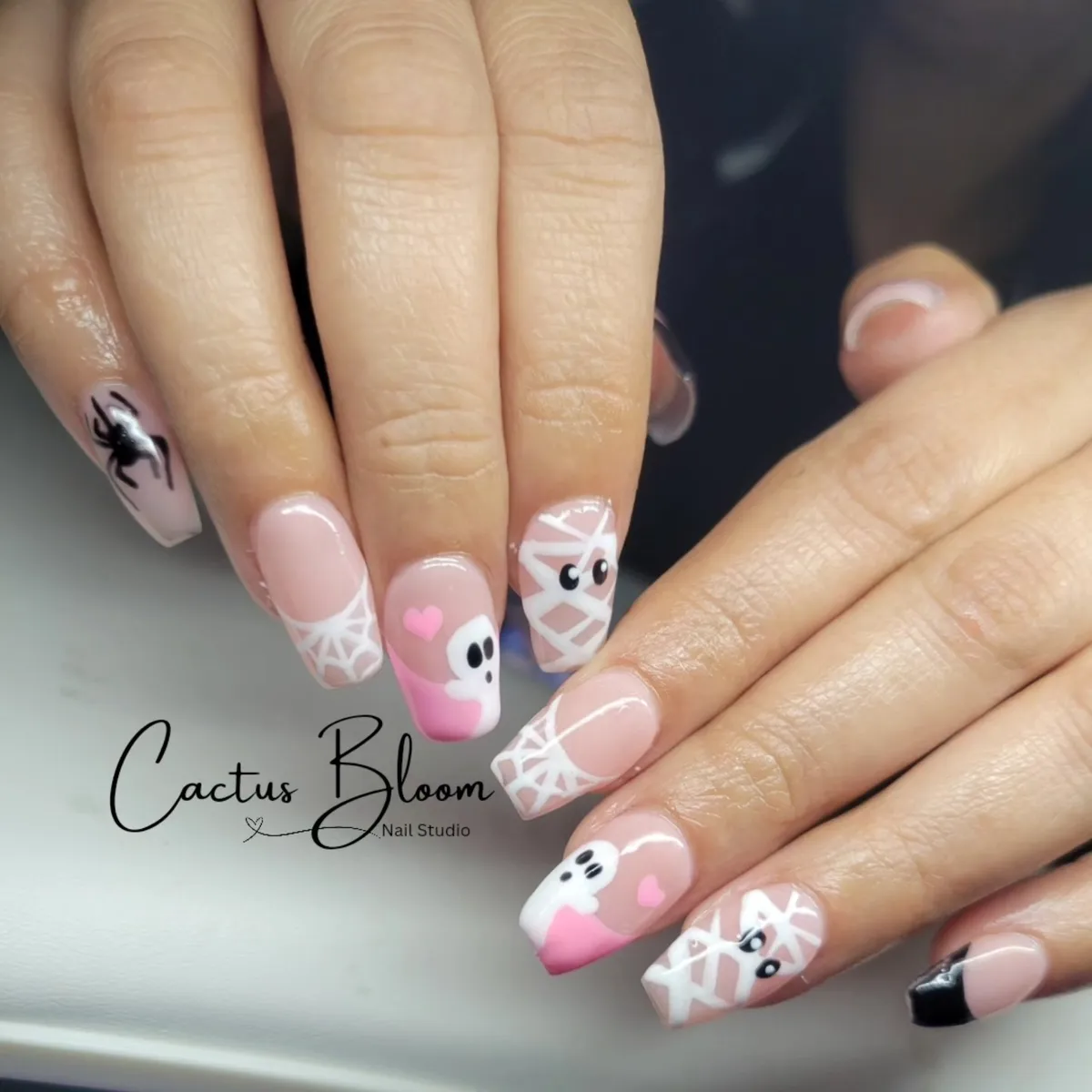 Pink web French tips with ghost and mummy accents
