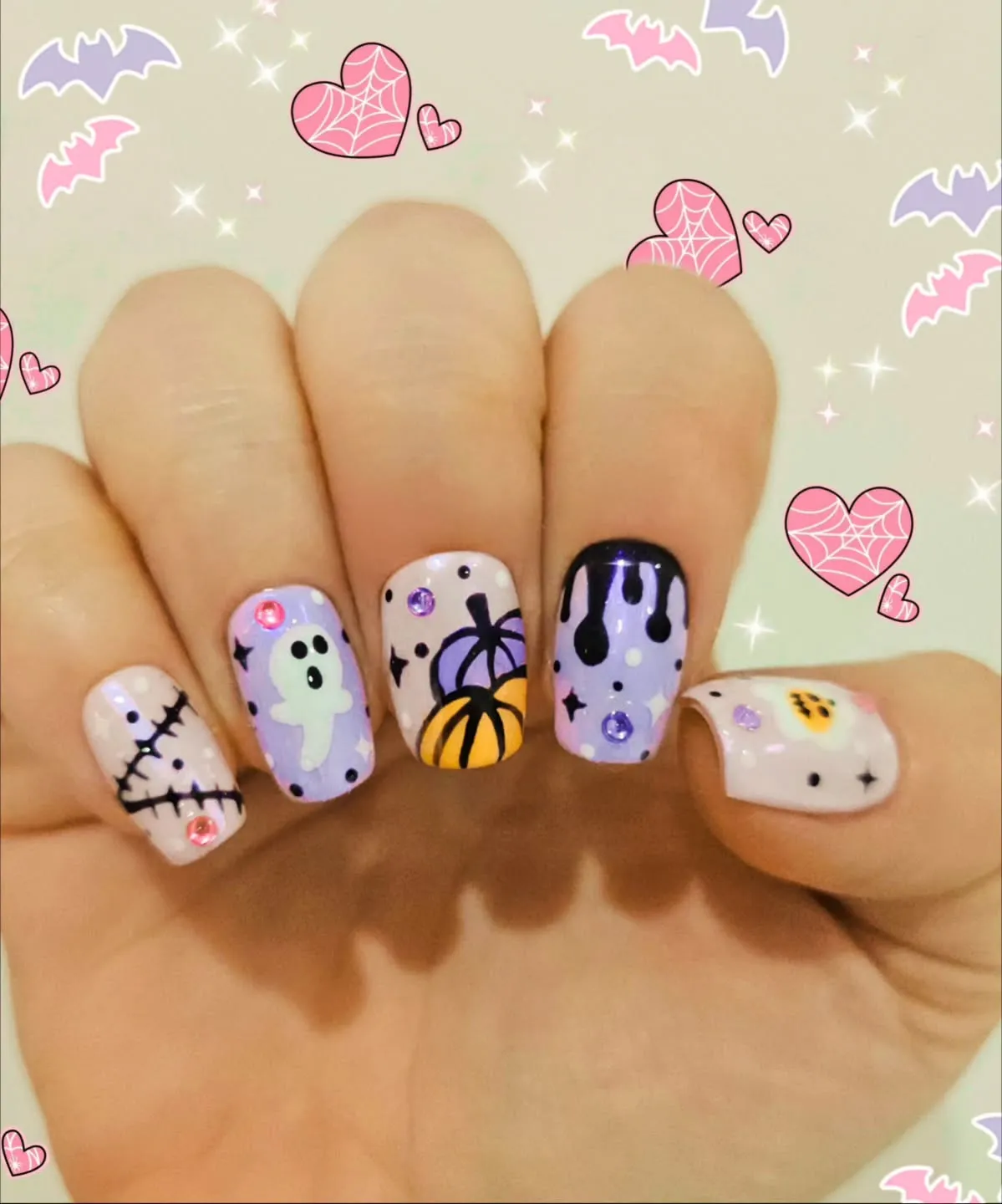 Pastel Halloween mix with gems, drips, ghost, and pumpkin