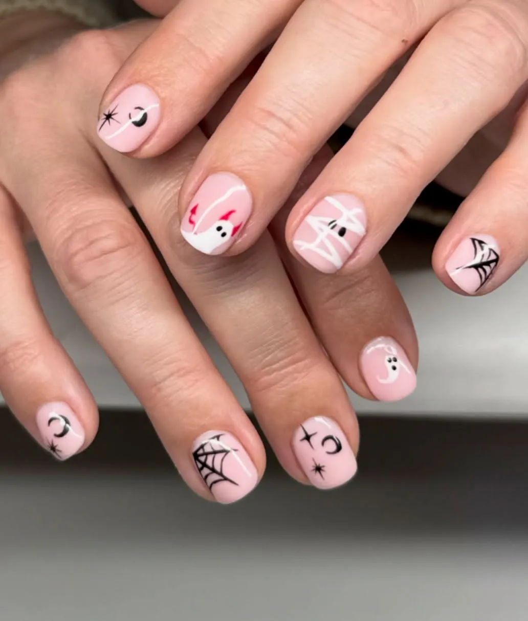 Simple pale pink set with black webs and tiny ghost accent