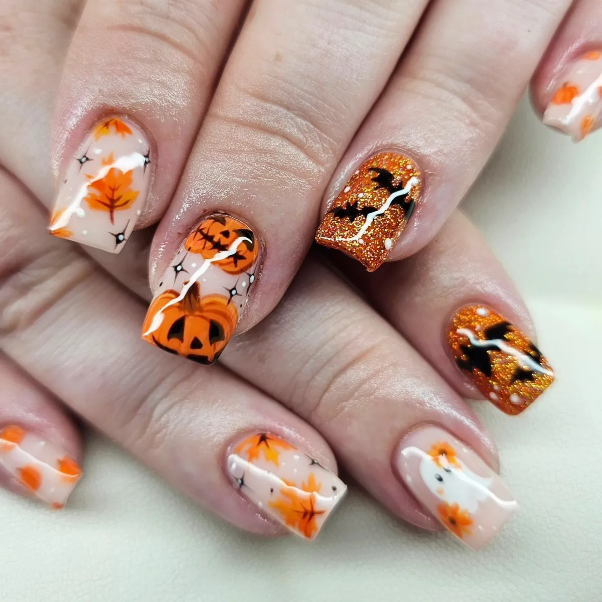 Autumn leaves with orange glitter bats