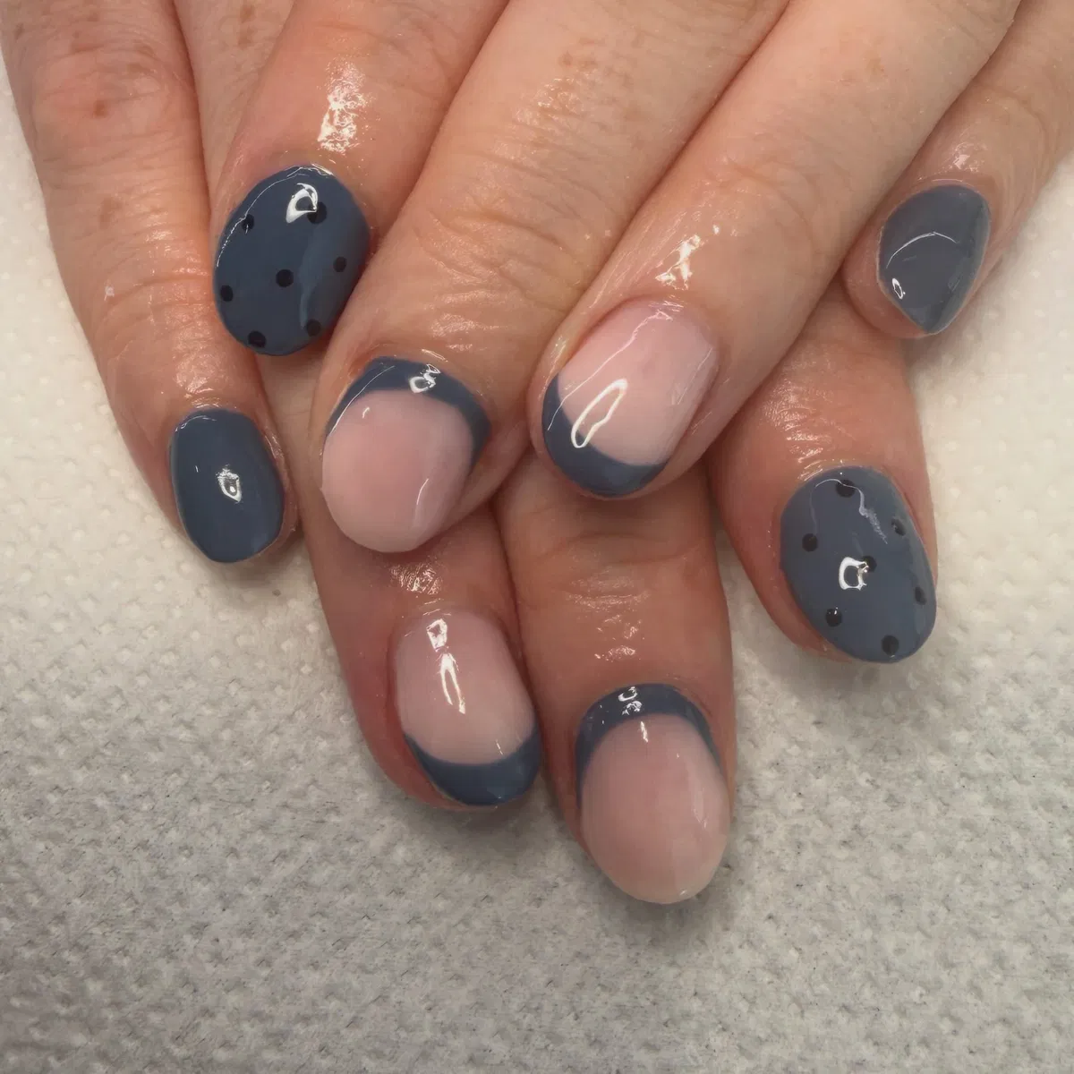 Slate-blue and pale pink with curved tips and polka dots
