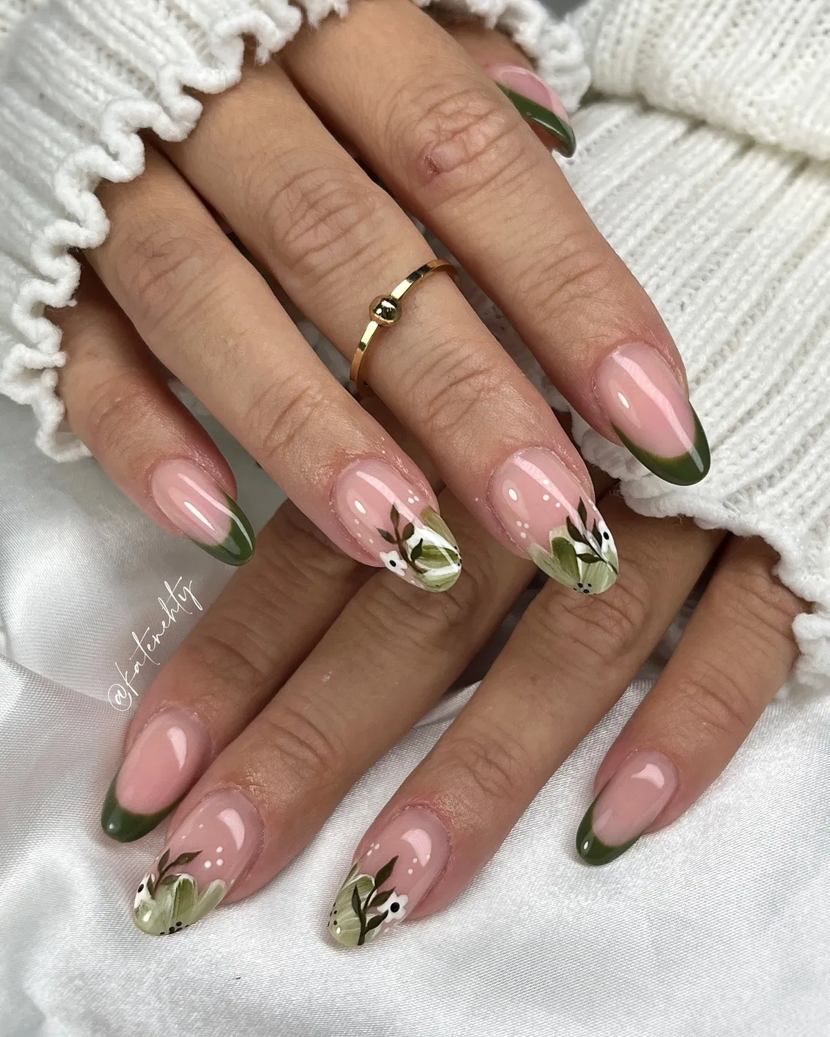 Green French tips with floral-and-leaf accent nails