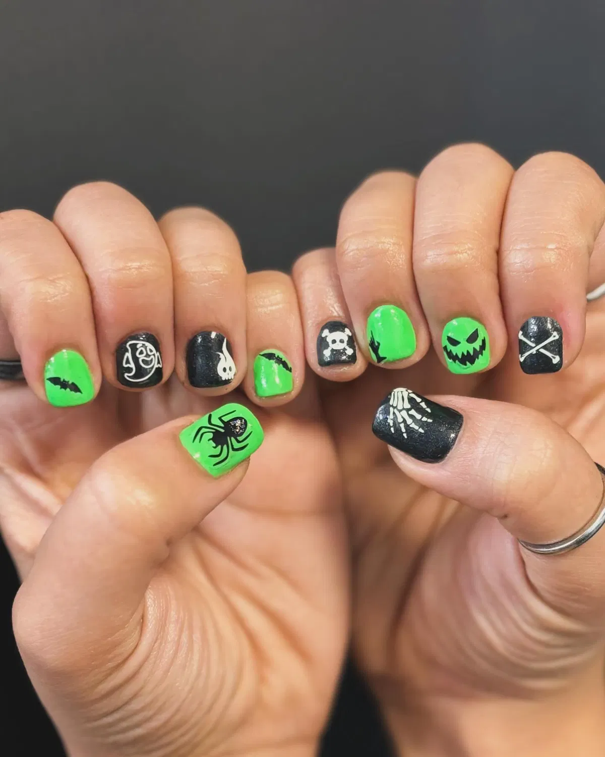 Short green-and-black icons with skulls and spider details