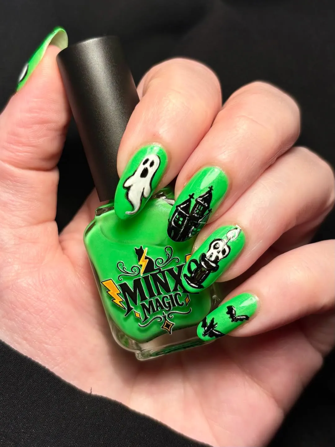 Green nails with ghost, haunted house, skull, and bats