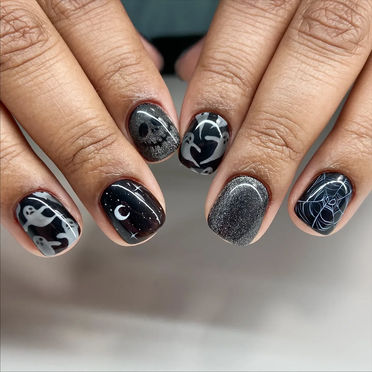 Glossy black mix-and-match: ghosts, moon, and web