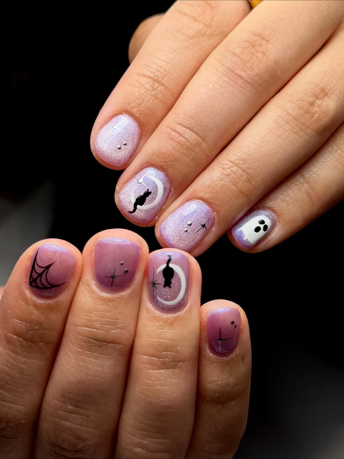 Purple shimmer gradient with moon-and-cat and ghost accents