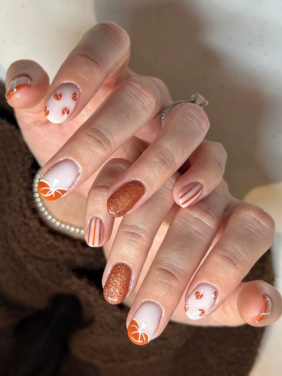 Soft pumpkin-inspired orange details with copper glitter accents