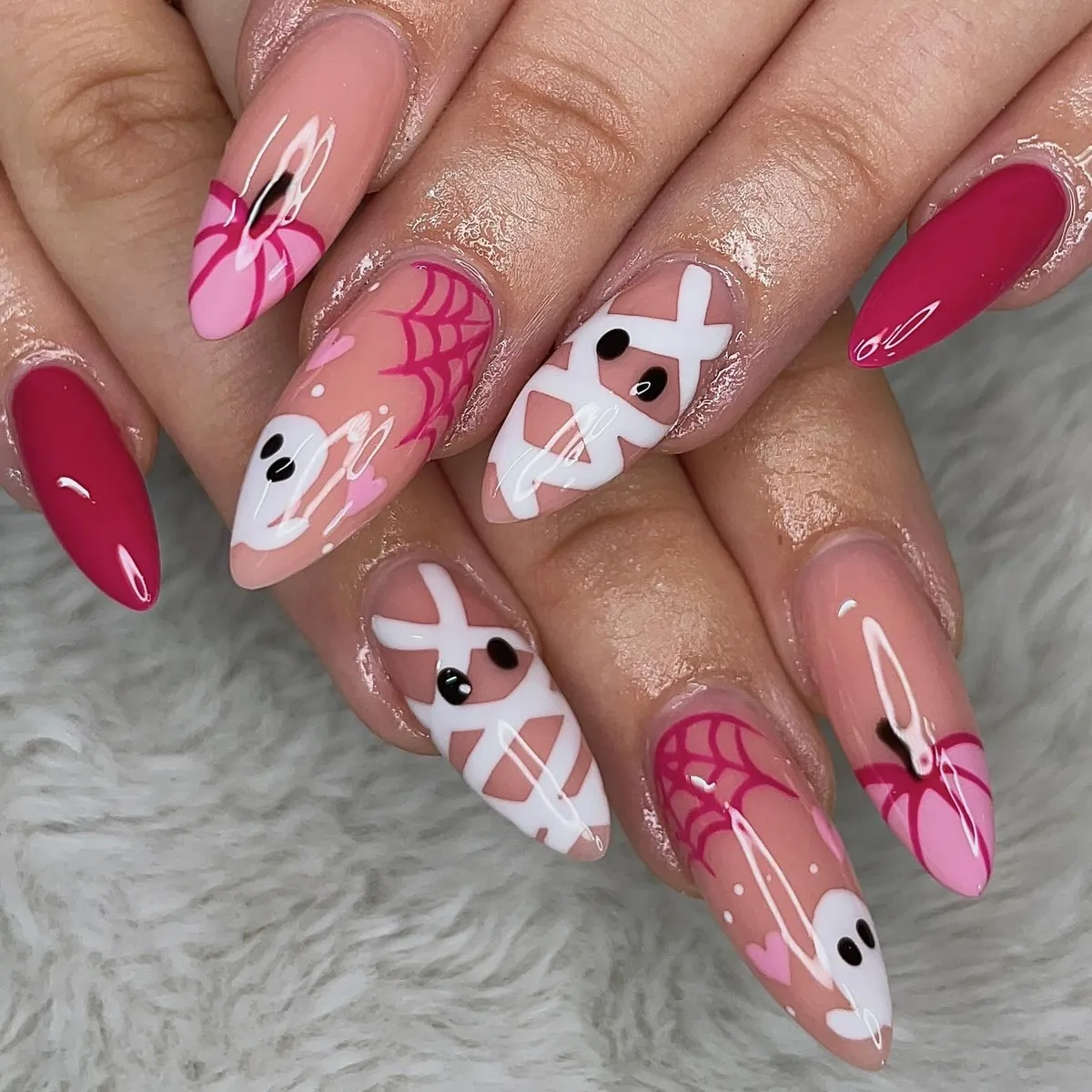 Pink-toned set with mummy wraps, spiderwebs, ghosts, and hearts