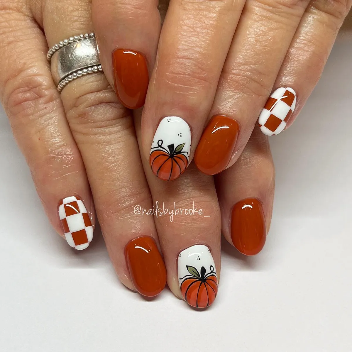 Burnt orange with pumpkin art and checkerboard accents