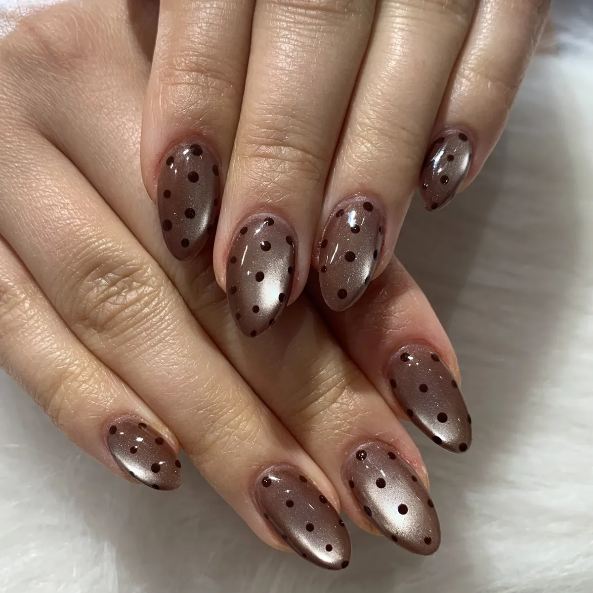 Metallic taupe-brown with dark polka dots