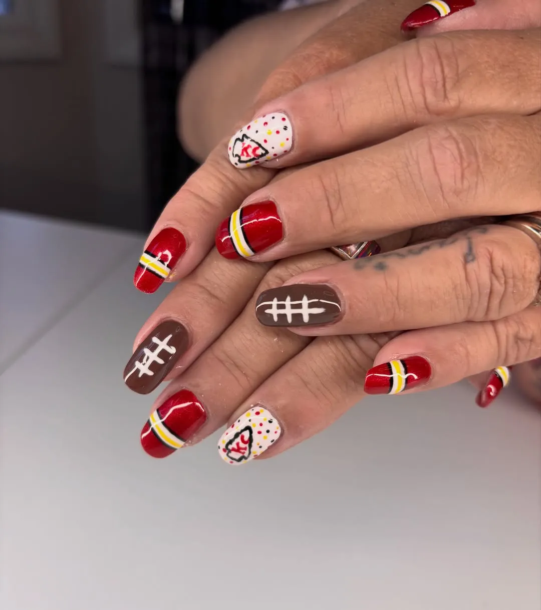Red stripe set with football-lace and "KC" accents