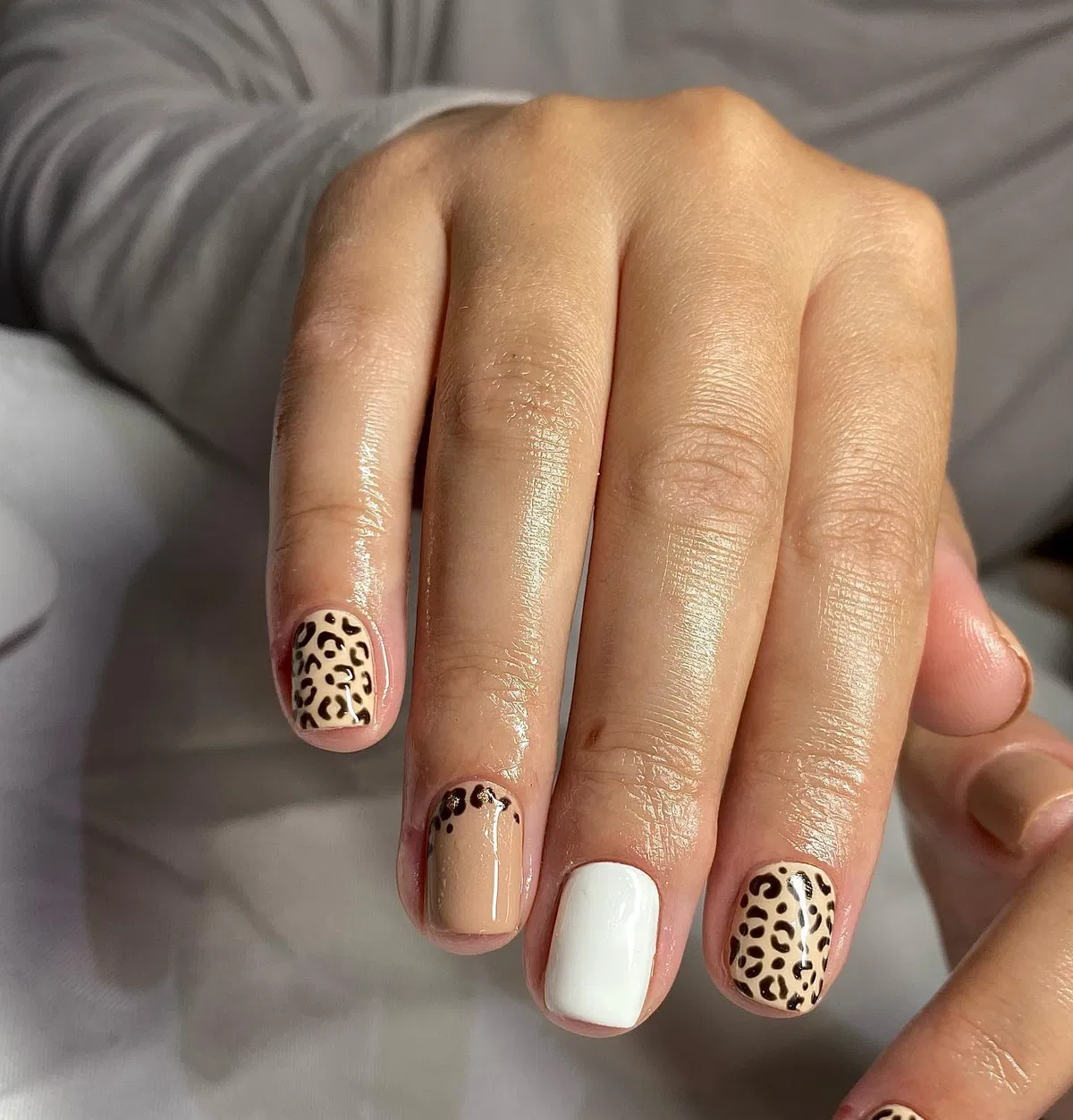 Beige and white with black leopard-spot accents