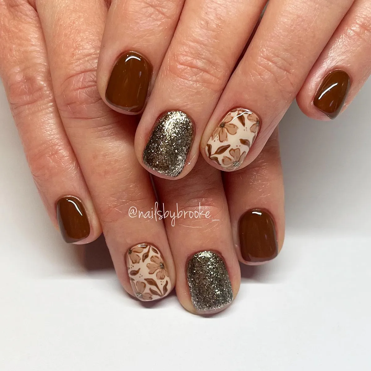 Medium brown with bronze glitter and beige leaf-print accents
