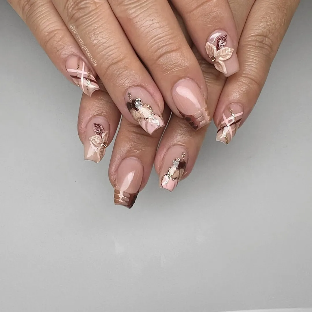 Nude-pink set with crisscross lines, marbled accents, and 3D flowers