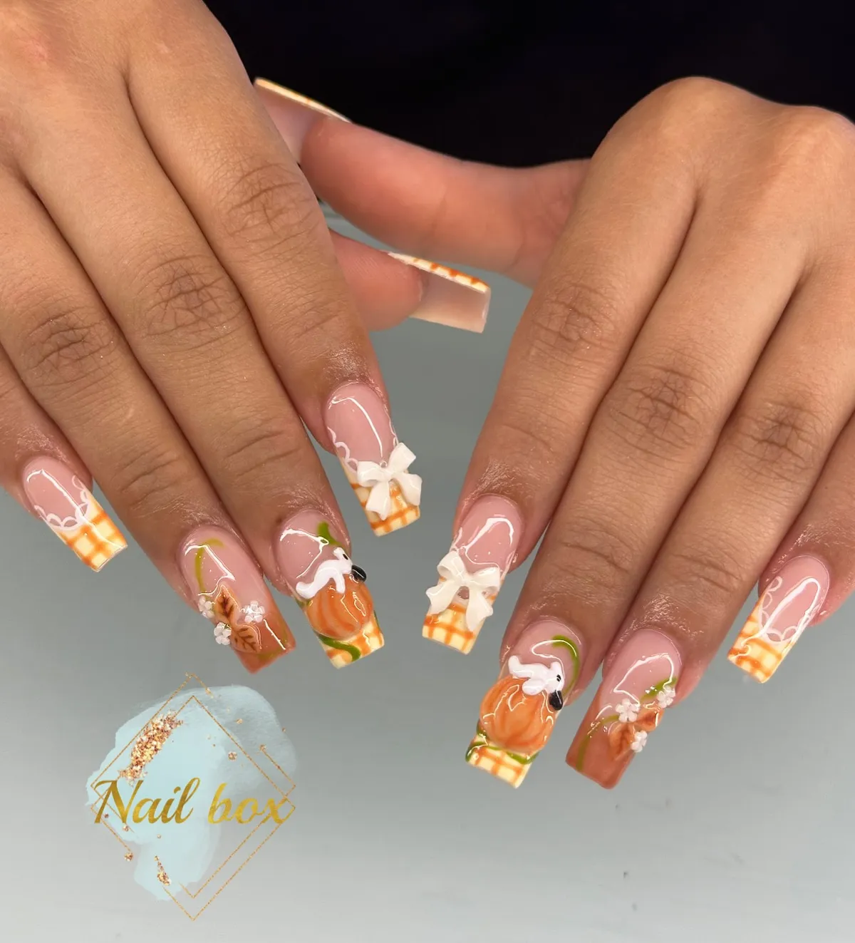 Checkered tips with bows and pumpkin accents