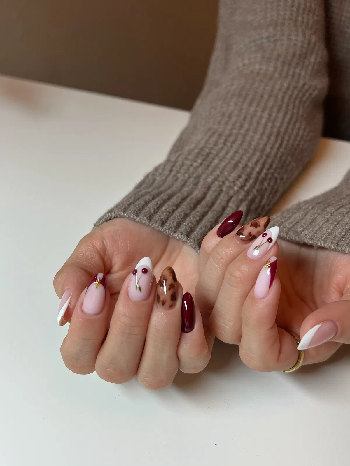 Burgundy, French tips, and berry accents
