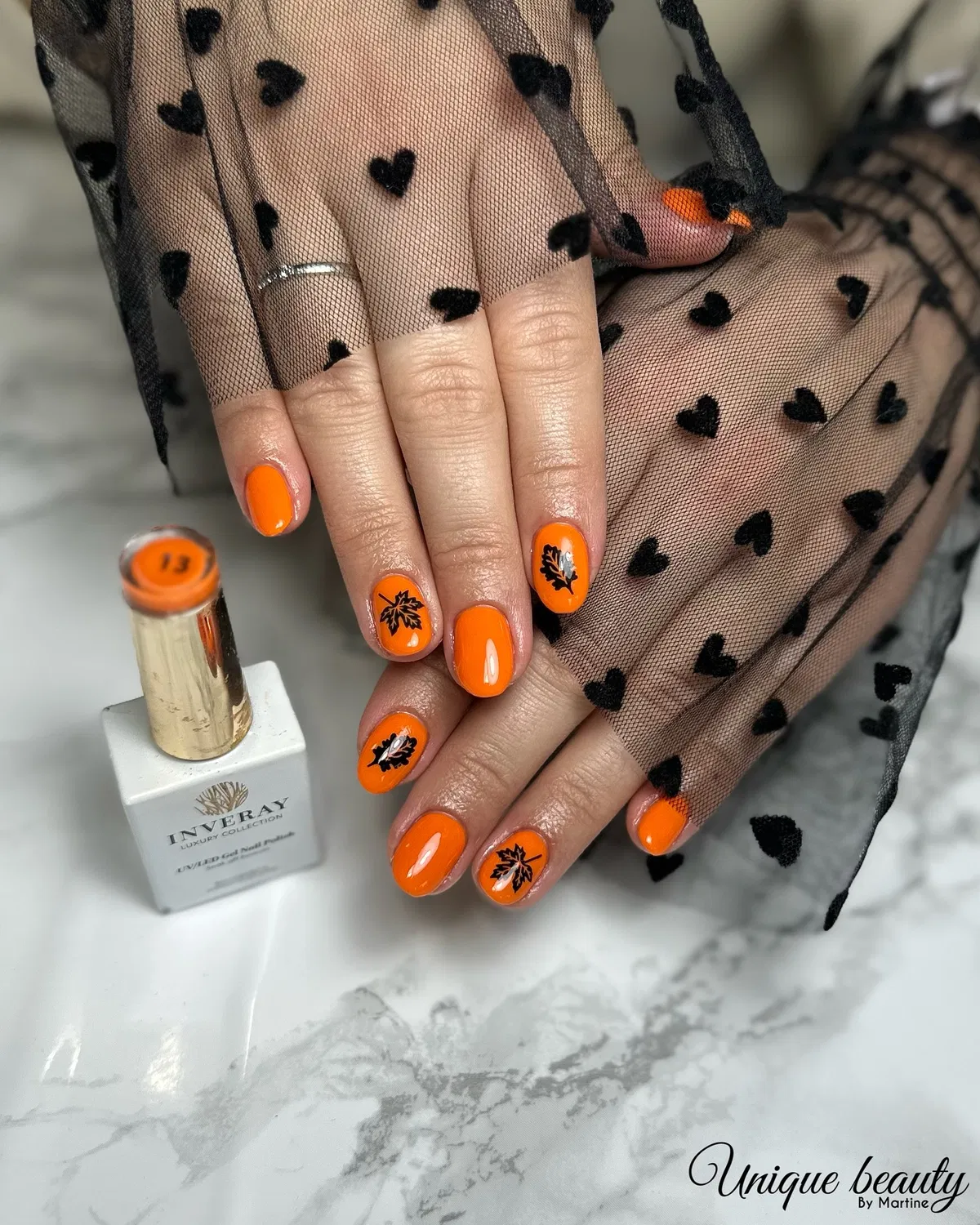Bright orange with black leaf silhouettes (product shown)