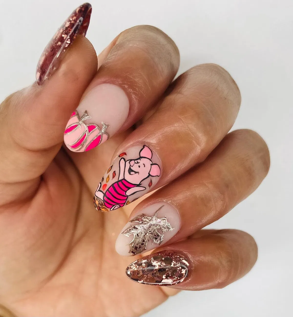 Cartoon character accent with silver leaf and glitter nails