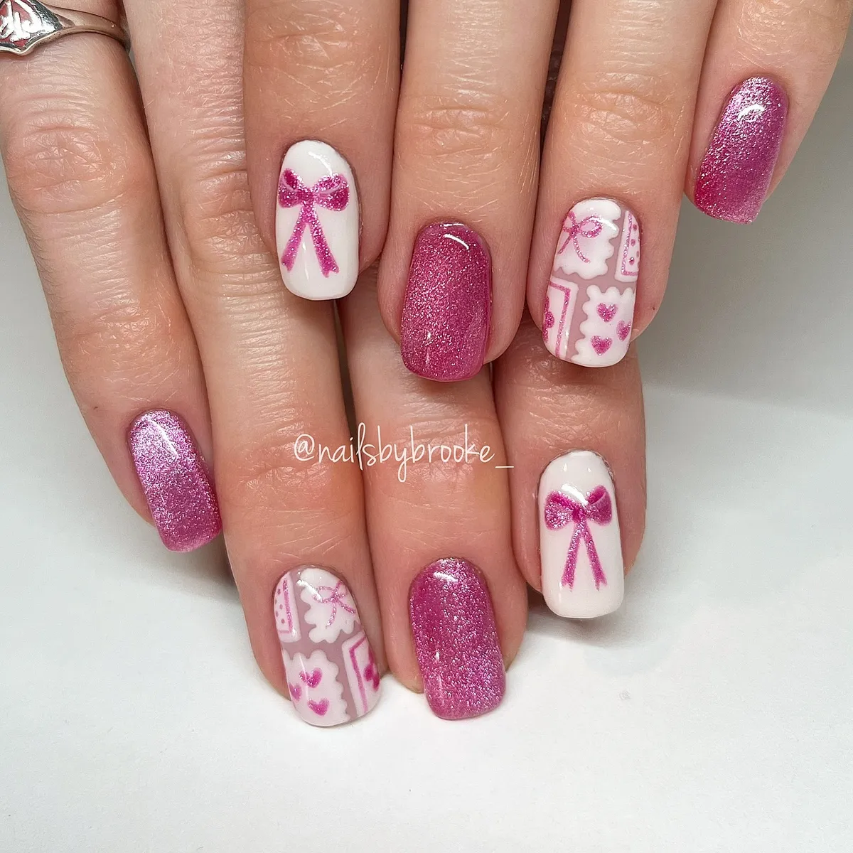Pink glitter with white bow and heart accents