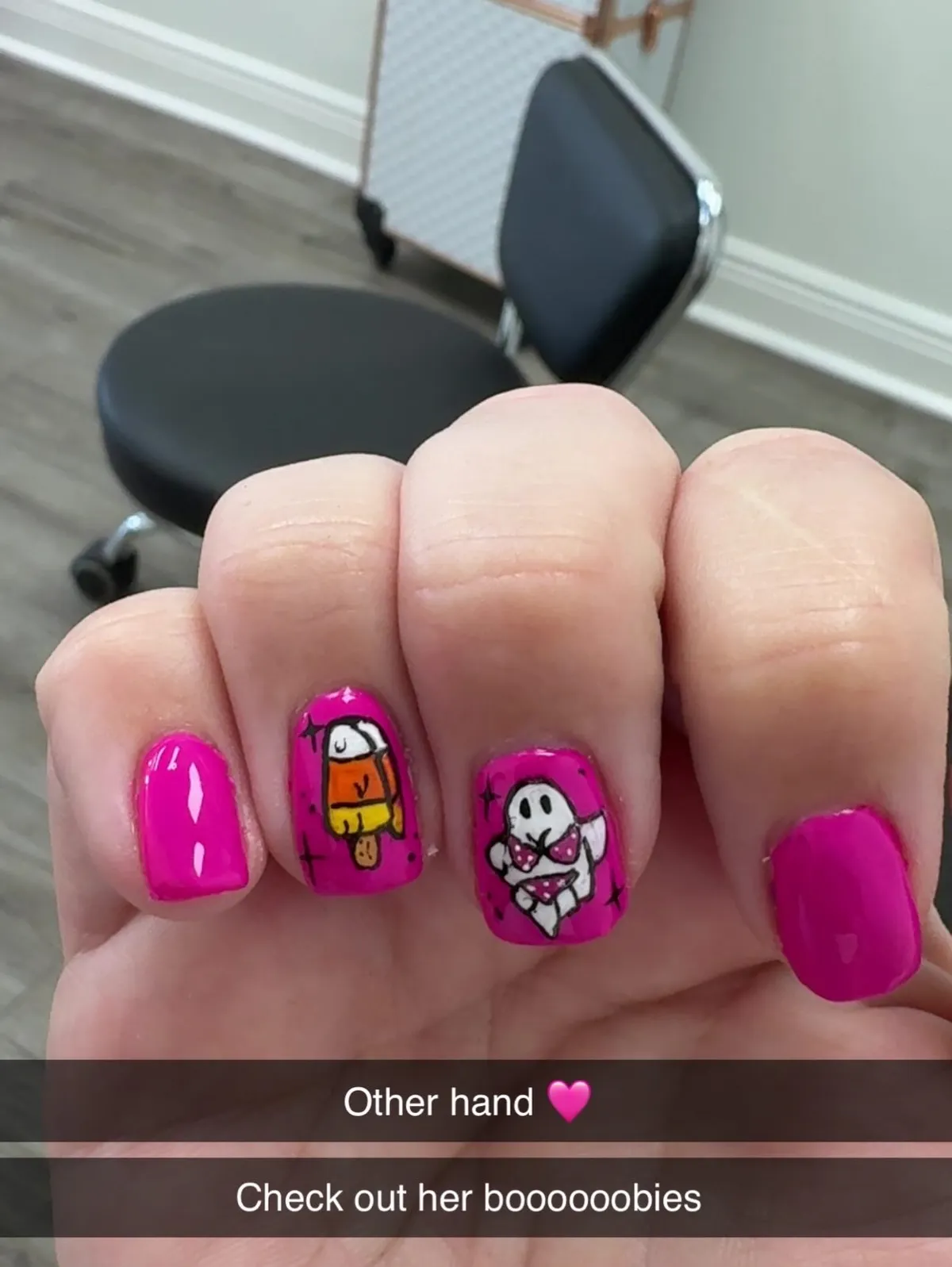 Hot pink short nails with candy-corn figure and bikini ghost