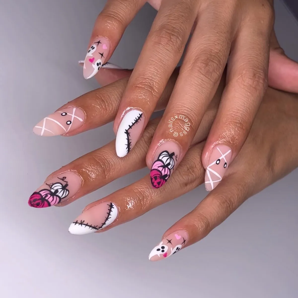 Pink pumpkin and stitched-line almond nails
