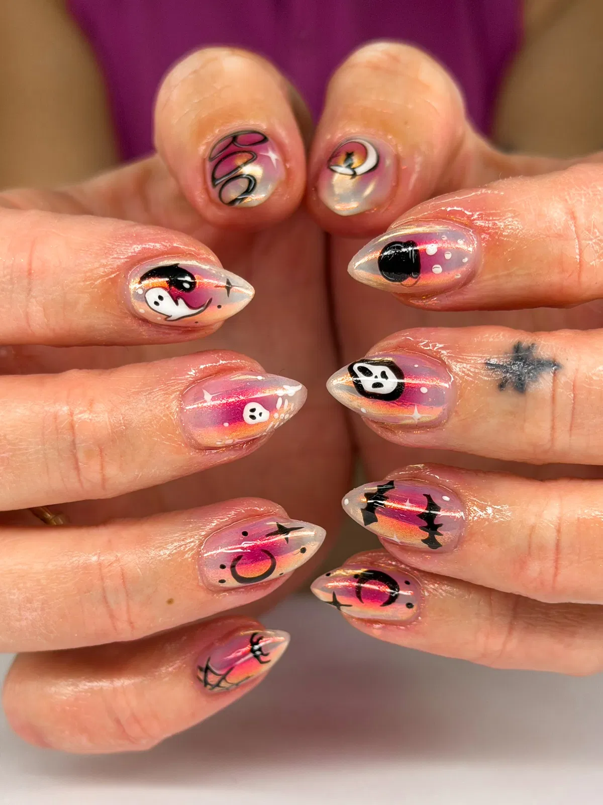Translucent multitone nails with bats, skull, and ghost