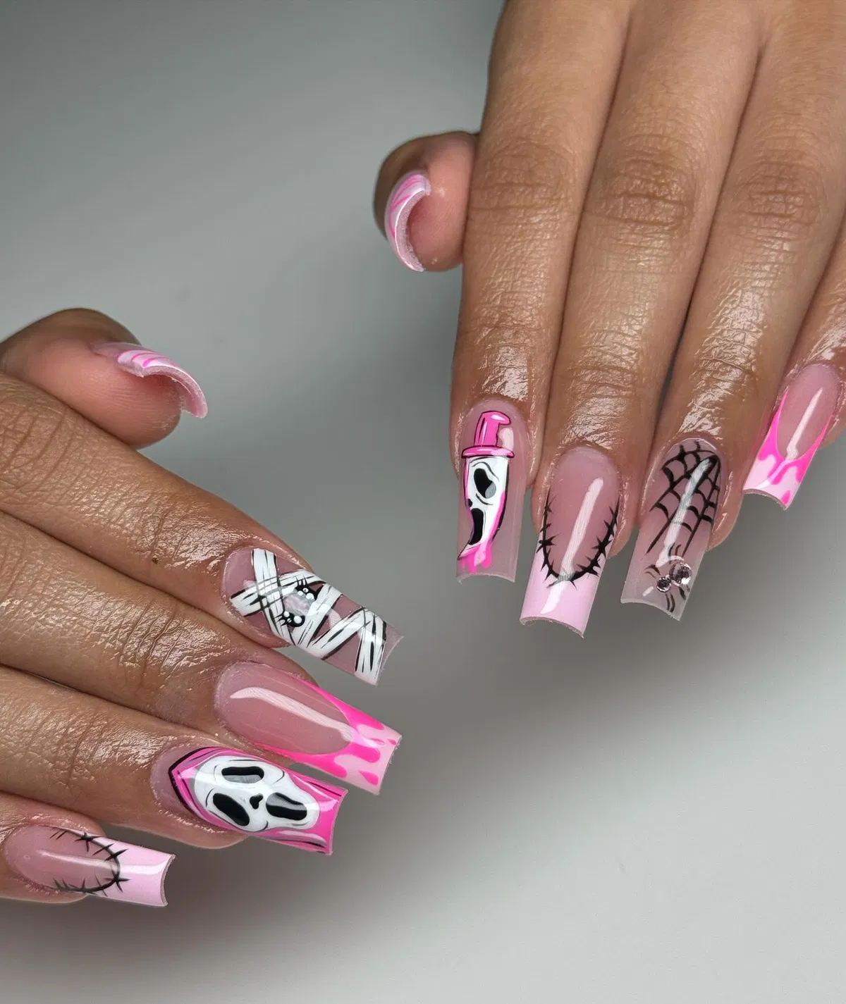 Long pink set with ghost faces, web, and stitches
