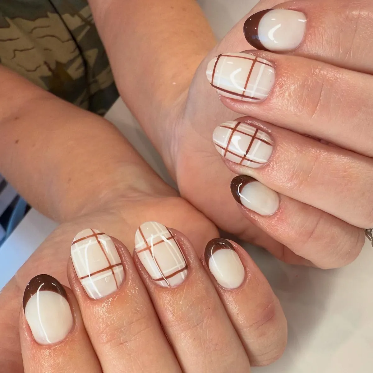 White nails with brown plaid and dark brown French tips