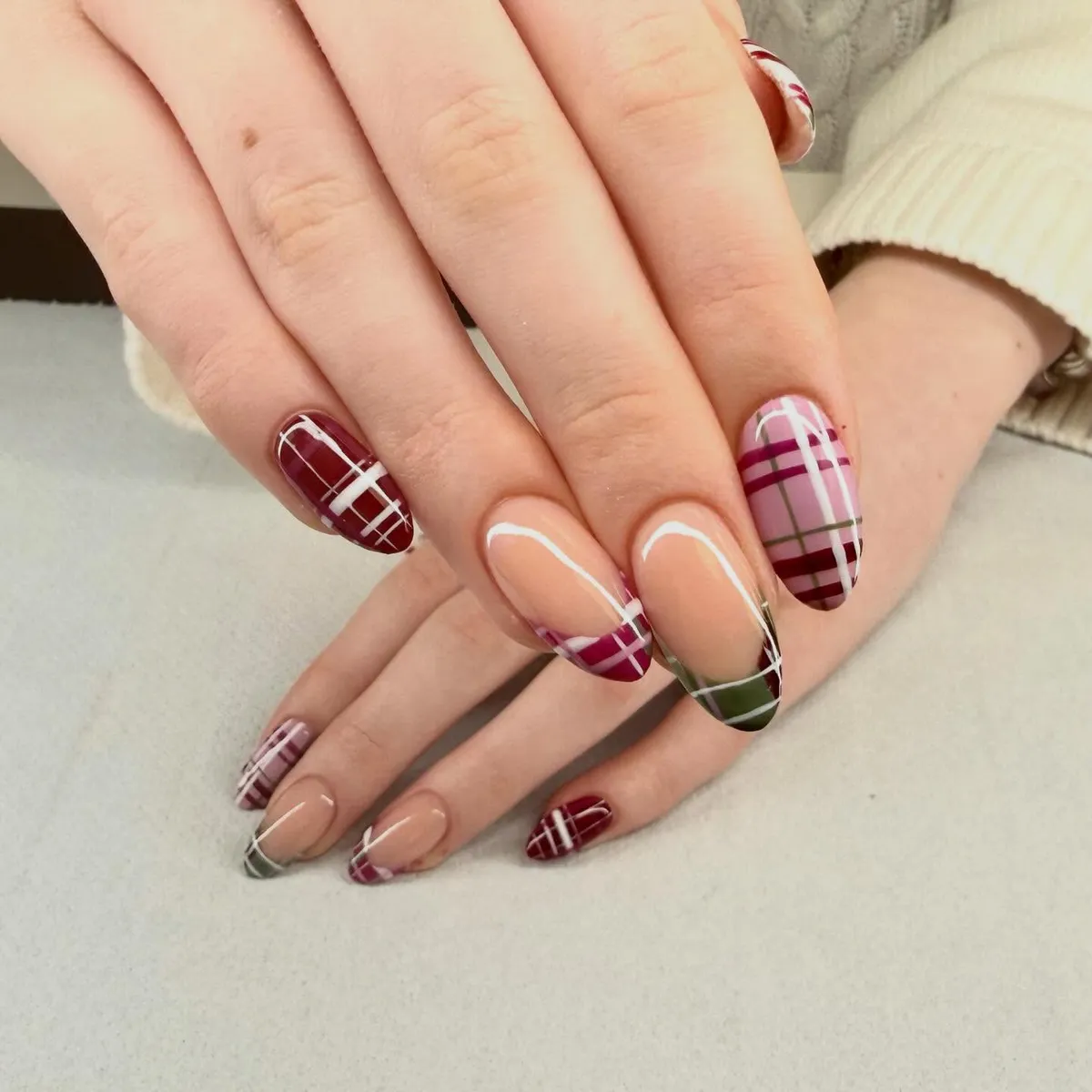 Burgundy-and-pink plaid mix with nude-base tips