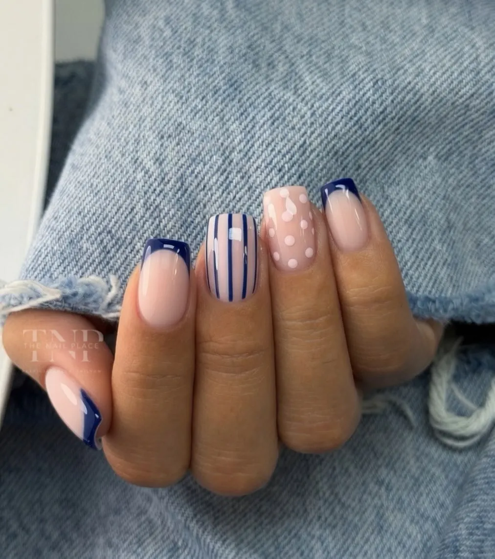 Deep blue French tips with stripe and polka-dot accents