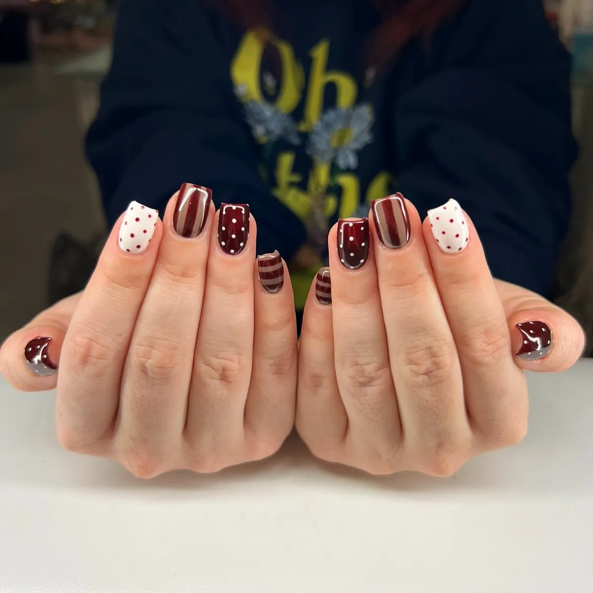 Brown and white mixed patterns with polka dots and stripes