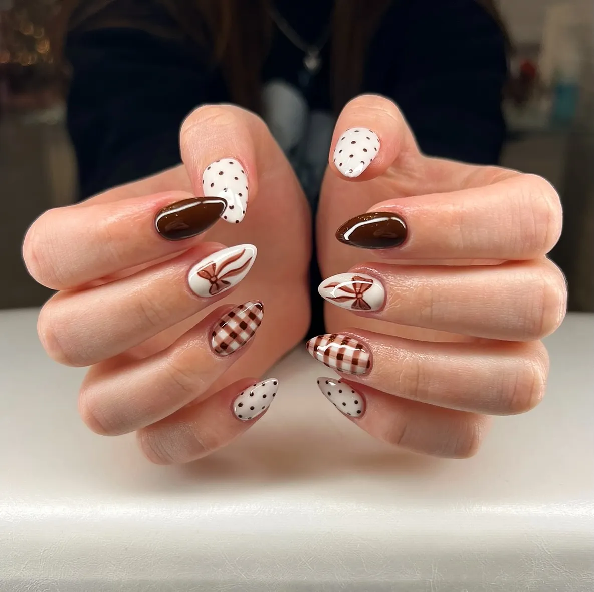 Brown-and-cream plaid with polka dots and bow accents