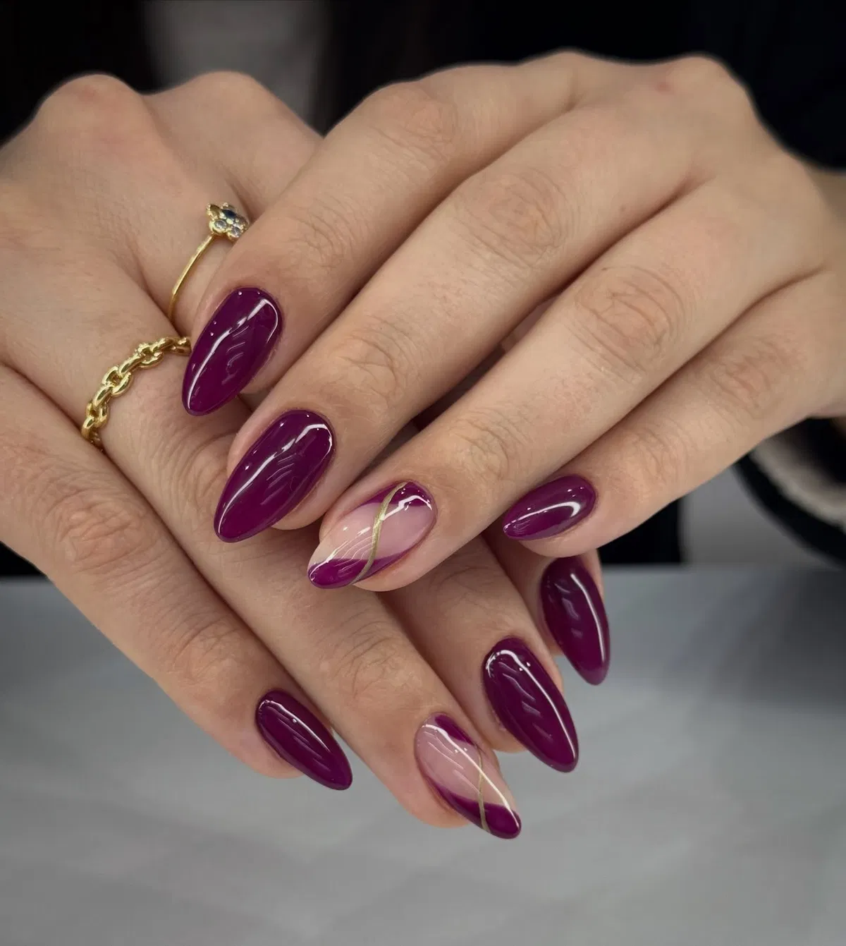 Deep plum solids with nude-and-gold diagonal accents