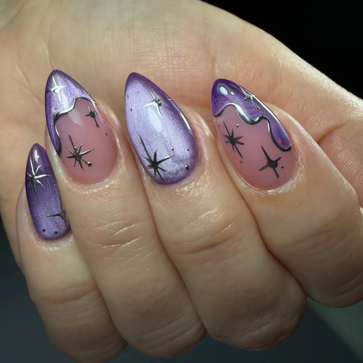 Purple shimmer with starburst motifs and wavy-edged accents