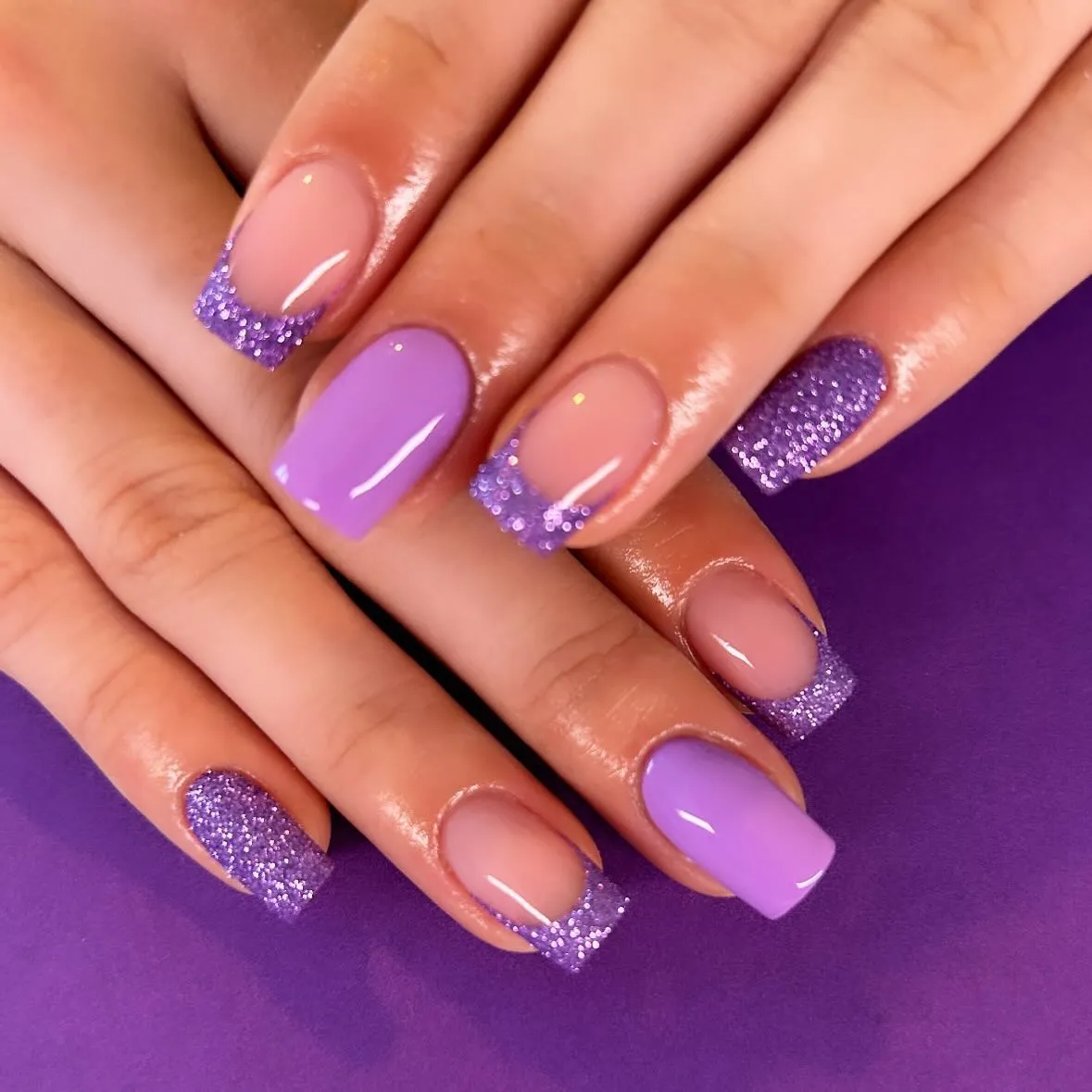 Lavender solids with purple glitter French tips