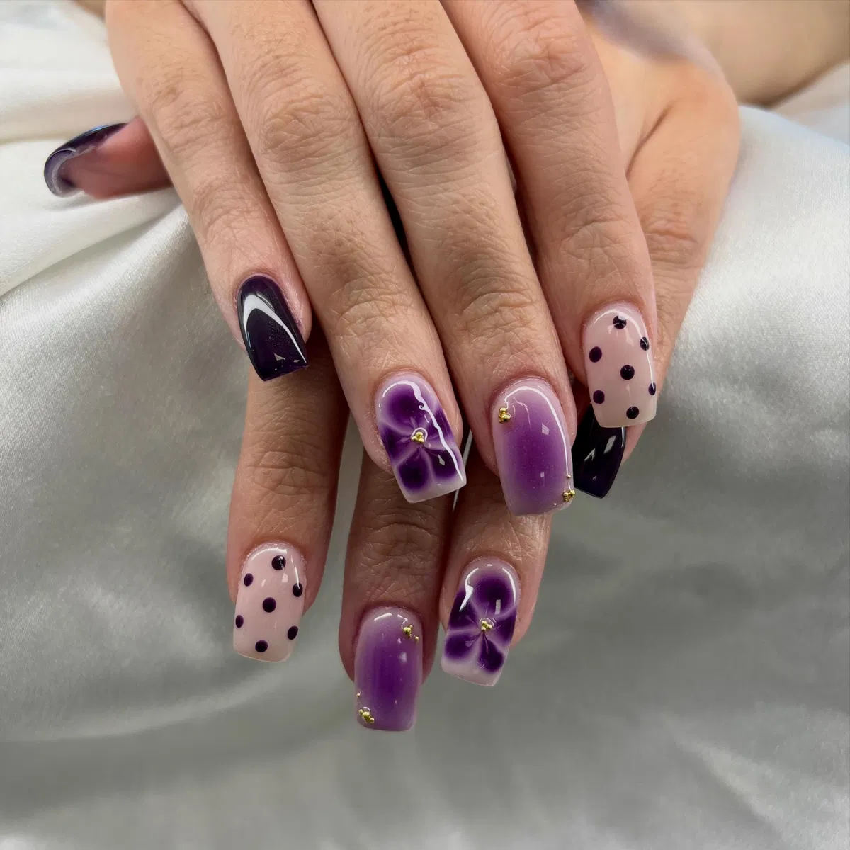 Plum mix-and-match with polka dots and purple florals