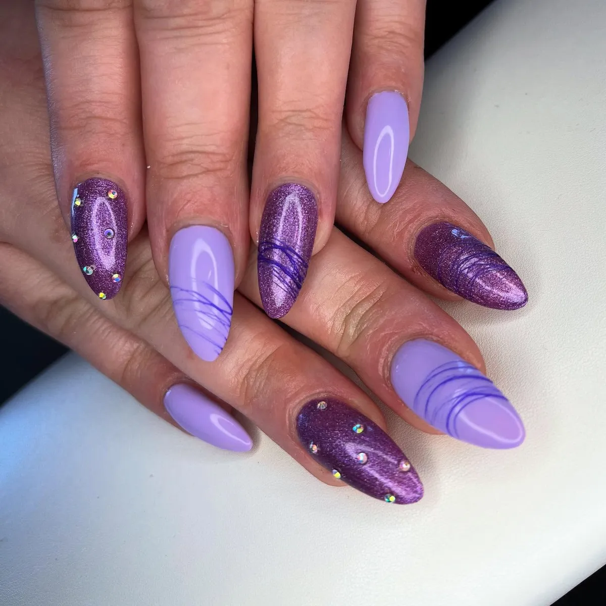Lavender and shimmery plum with fine line accents and gems
