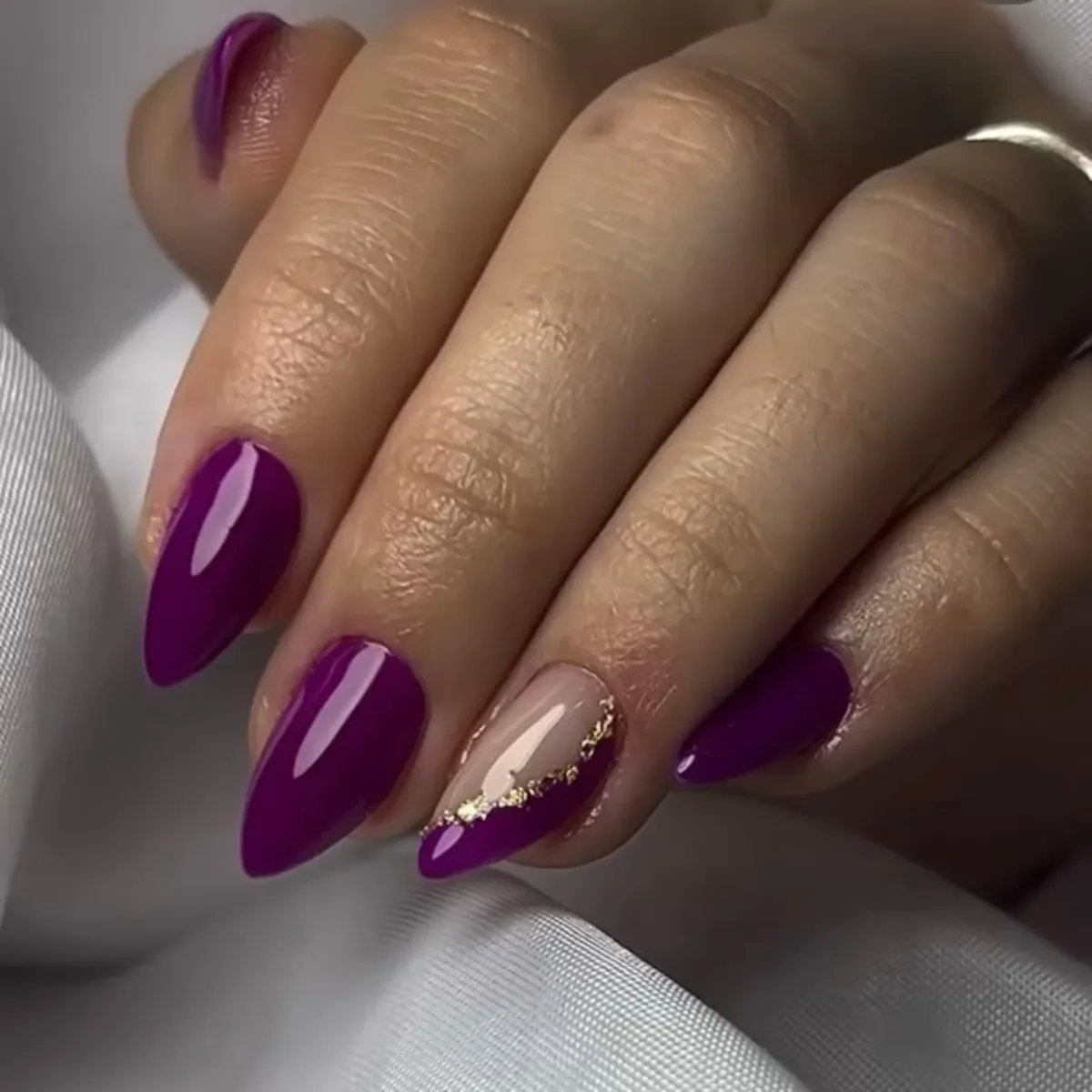 Diagonal nude-and-plum accent with gold line
