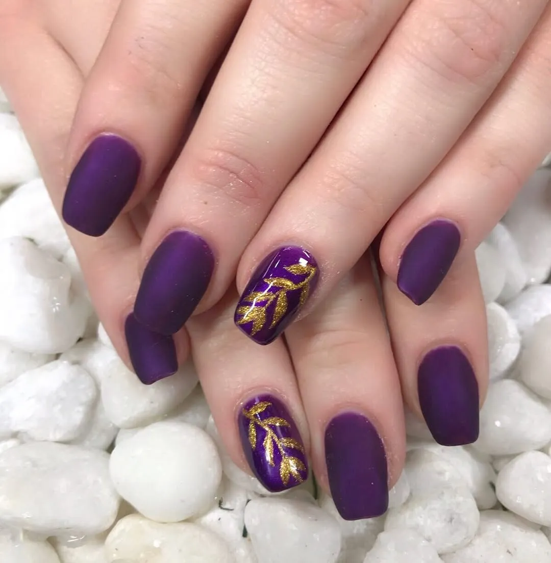 Matte deep purple coffins with gold vine accents
