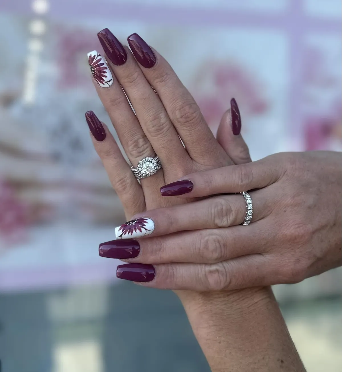Long plum set with white floral accent nails
