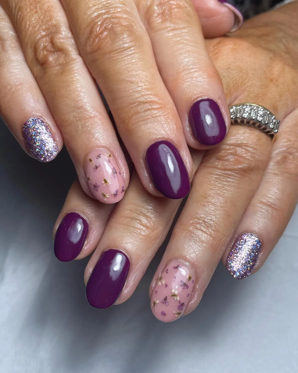 Plum gloss with silver glitter and confetti-style accents