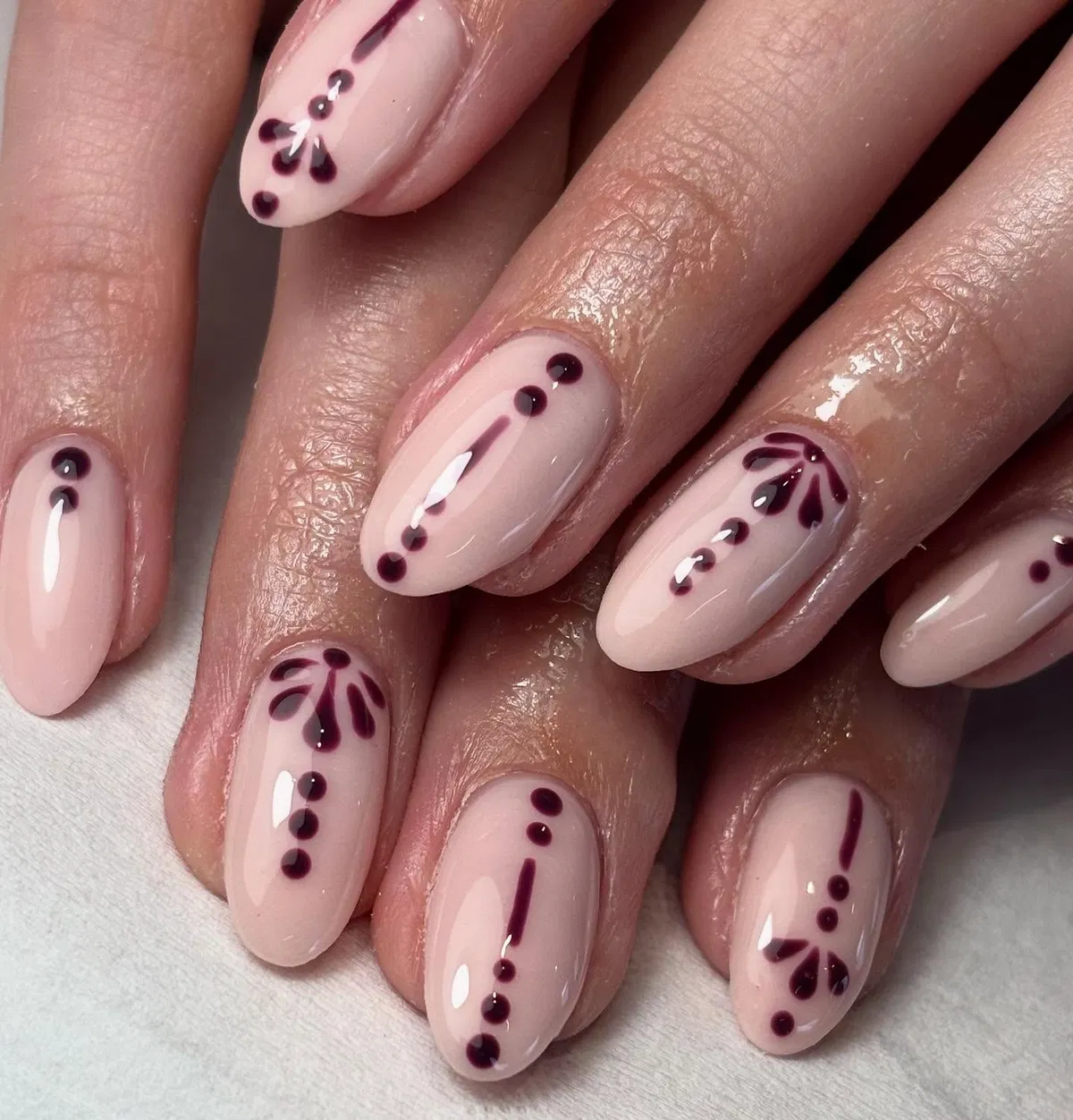 Minimal nude base with plum dot-and-line motifs