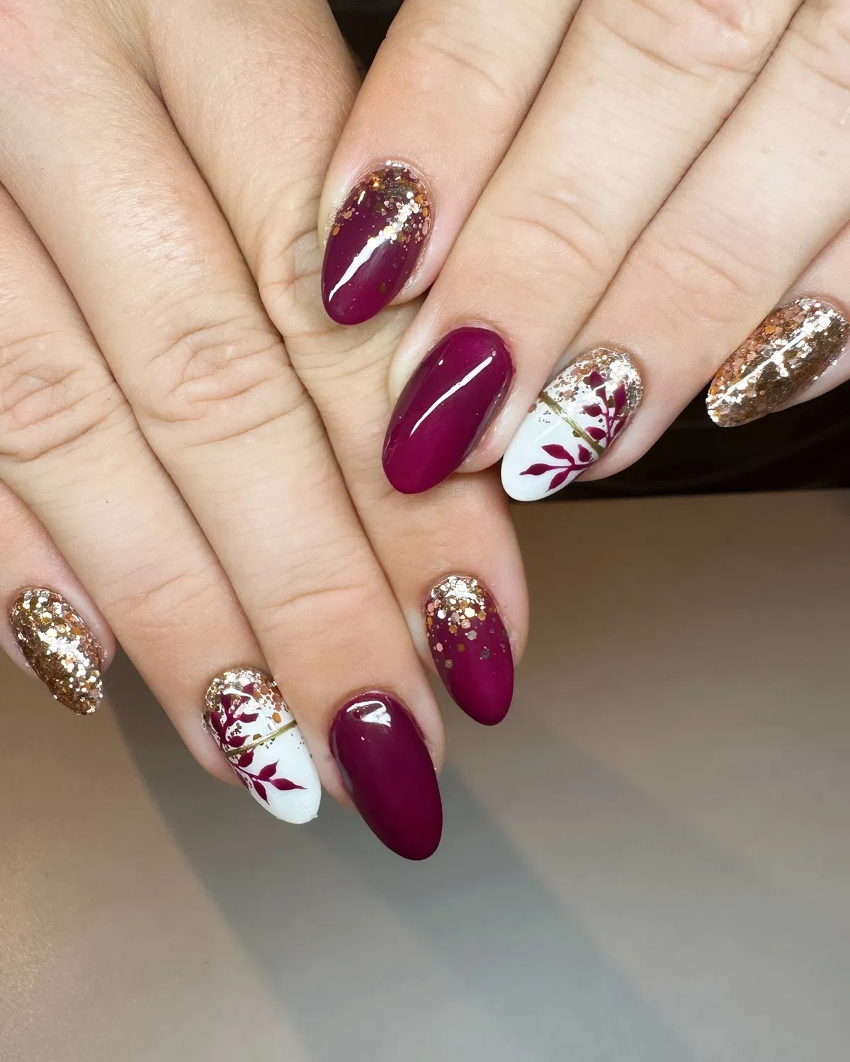 Almond plum with gold glitter and white leaf accents