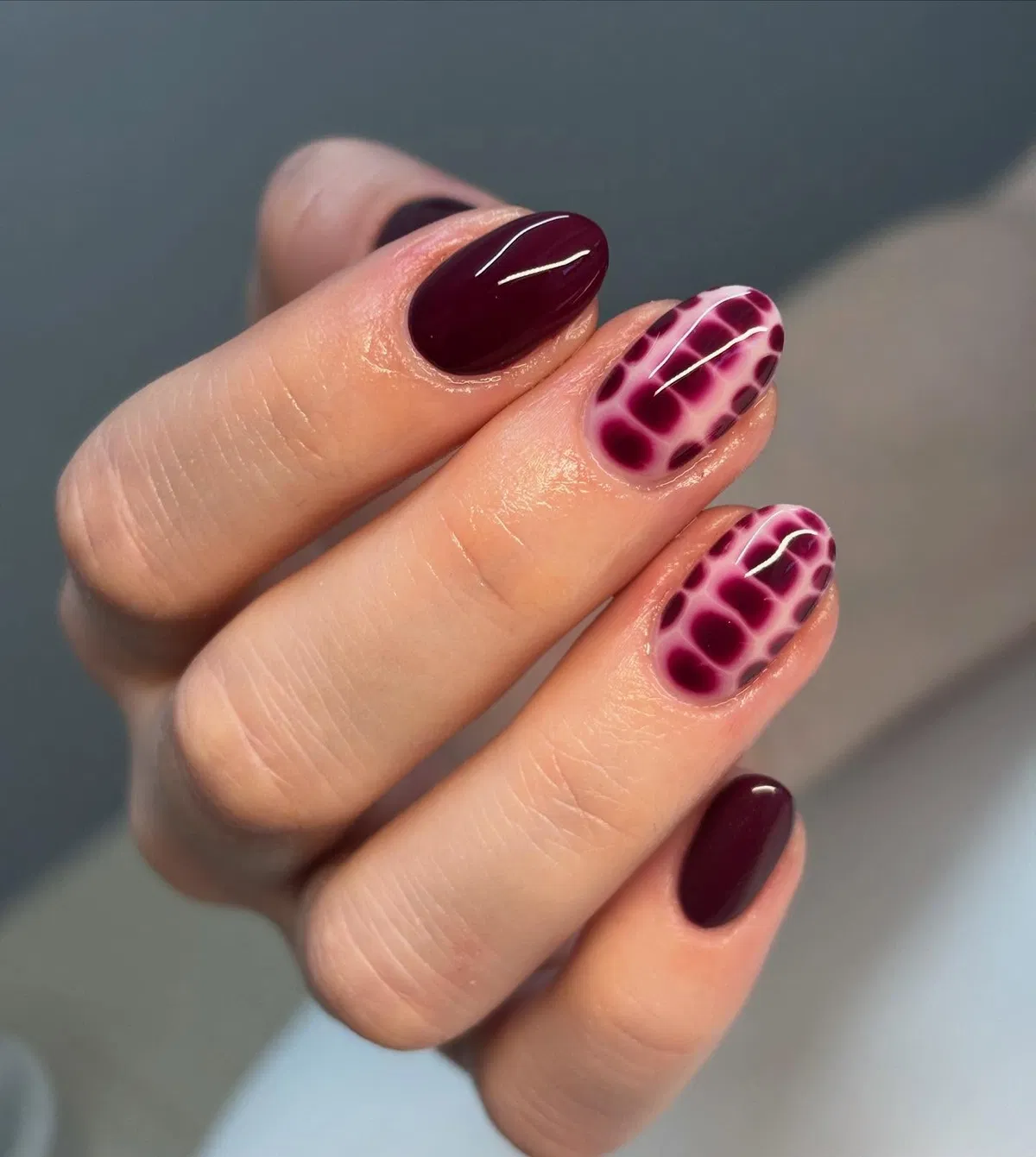 Deep plum with spotted accent nails