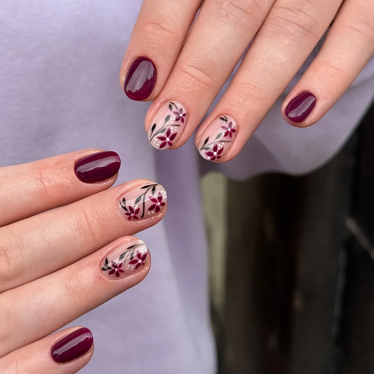Deep plum with delicate floral accents on nude