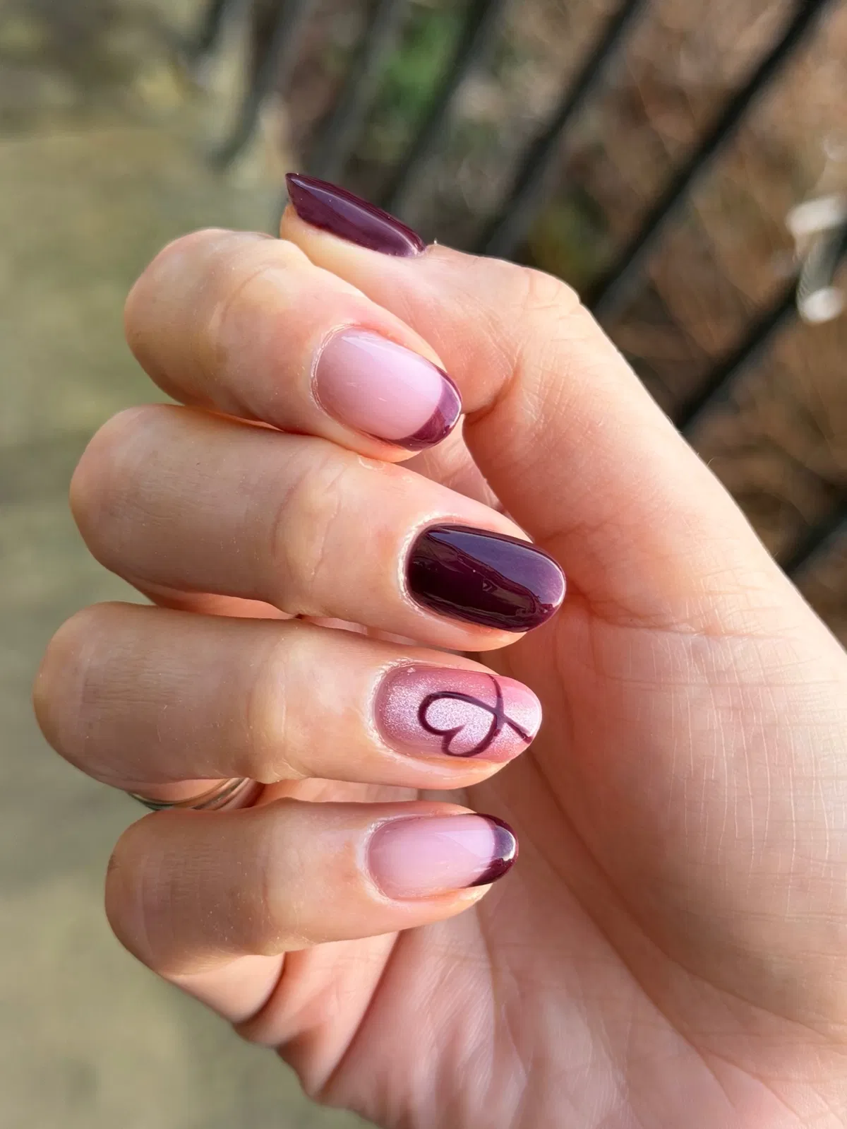 Plum French tips with a heart accent