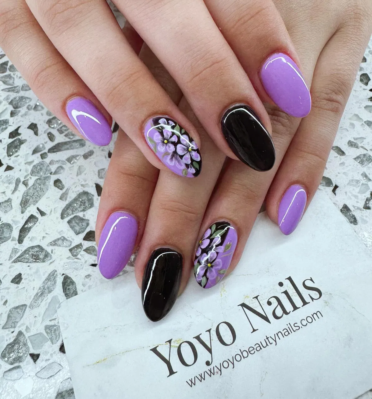 Lavender and black mix with floral accent nails